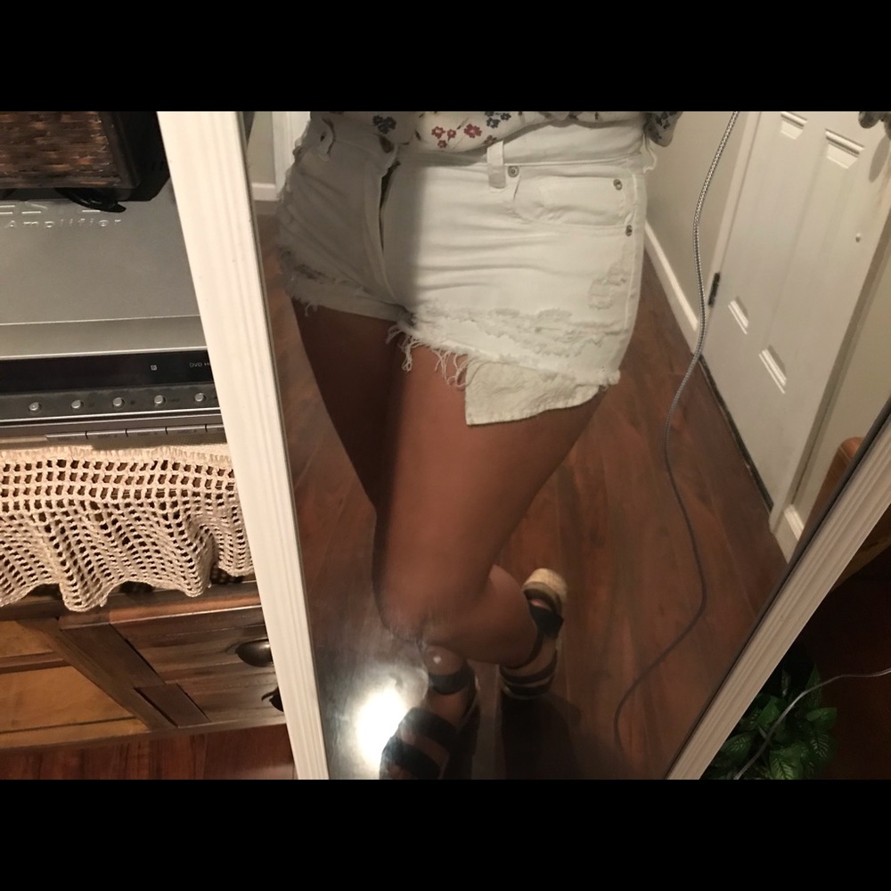 White ripped jean shorts